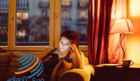 Unhappy woman at home text messaging