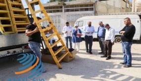 قلقيلية: توزيع أدوات لقطف الزيتون في المناطق المعزولة خلف جدار الفصل العنصري.