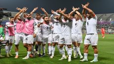 Palestine's forward #11 Oday Dabbagh celebrates with teammates after scoring the first goal during the Qatar 2023 AFC Asian Cup Group C football match between Hong Kong and Palestine at the Abdullah bin Khalifa Stadium in Doha on January 23, 2024. (Photo by Hector RETAMAL / AFP)