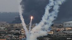 Palestinian militants fire rockets towards Israel from Rafah, southern Gaza Strip, on October 11, 2023. Israel on October 11 kept up its bombardment of Hamas targets in the Gaza Strip, as Prime Minister Benjamin Netanyahu and a political rival announced an emergency government for the duration of the conflict that has already killed thousands. (Photo by SAID KHATIB / AFP)