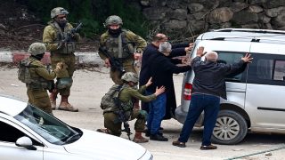 Israeli detain men during an ongoing Israeli raid in the Tulkarem camp for Palestinian refugees in the occupied West Bank on February 19, 2025. Since January 21, the Israeli military has been conducting a major operation in the "triangle" of Jenin, Tubas and Tulkarem, where half a million Palestinians live. (Photo by Zain JAAFAR / AFP) (Photo by ZAIN JAAFAR/AFP via Getty Images)