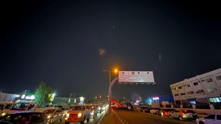 Traces are seen in the sky after Iran's armed forces say they targeted The Al-Udeid base in a missile attack, in Qatar, June 23, 2025. REUTERS/Stringer