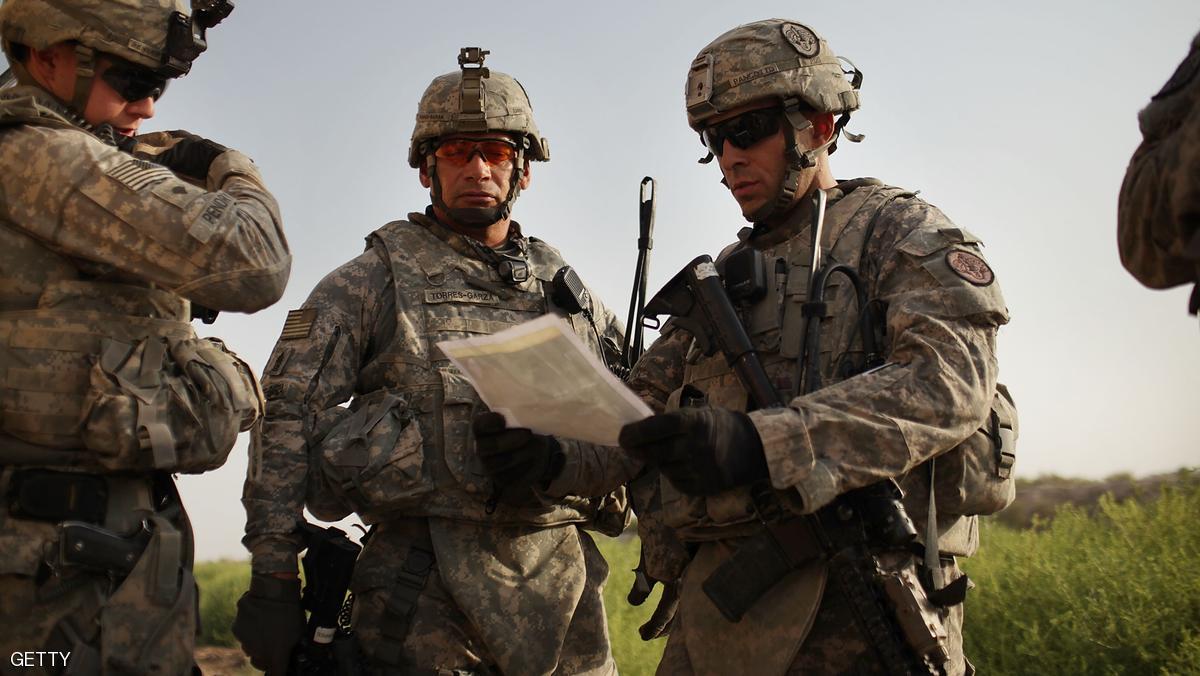 ISKANDARIYA, IRAQ - JULY 17: U.S. soldiers with the 3rd Armored Cavalry Regiment look at a map while on a patrol on July 17, 2011 in Iskandariya, Babil Province Iraq. As the deadline for the departure of the remaining American forces in Iraq approaches, Iraqi politicians have agreed to meet in two weeks time in order to give a final decision about extending the U.S. troops' presence beyond the end of the 2011 deadline. Violence against foreign troops has recently picked-up with June being the worst month in combat-related deaths for the military in Iraq in more than two years. Currently about 46,000 U.S. soldiers remain in Iraq. (Photo by Spencer Platt/Getty Images)